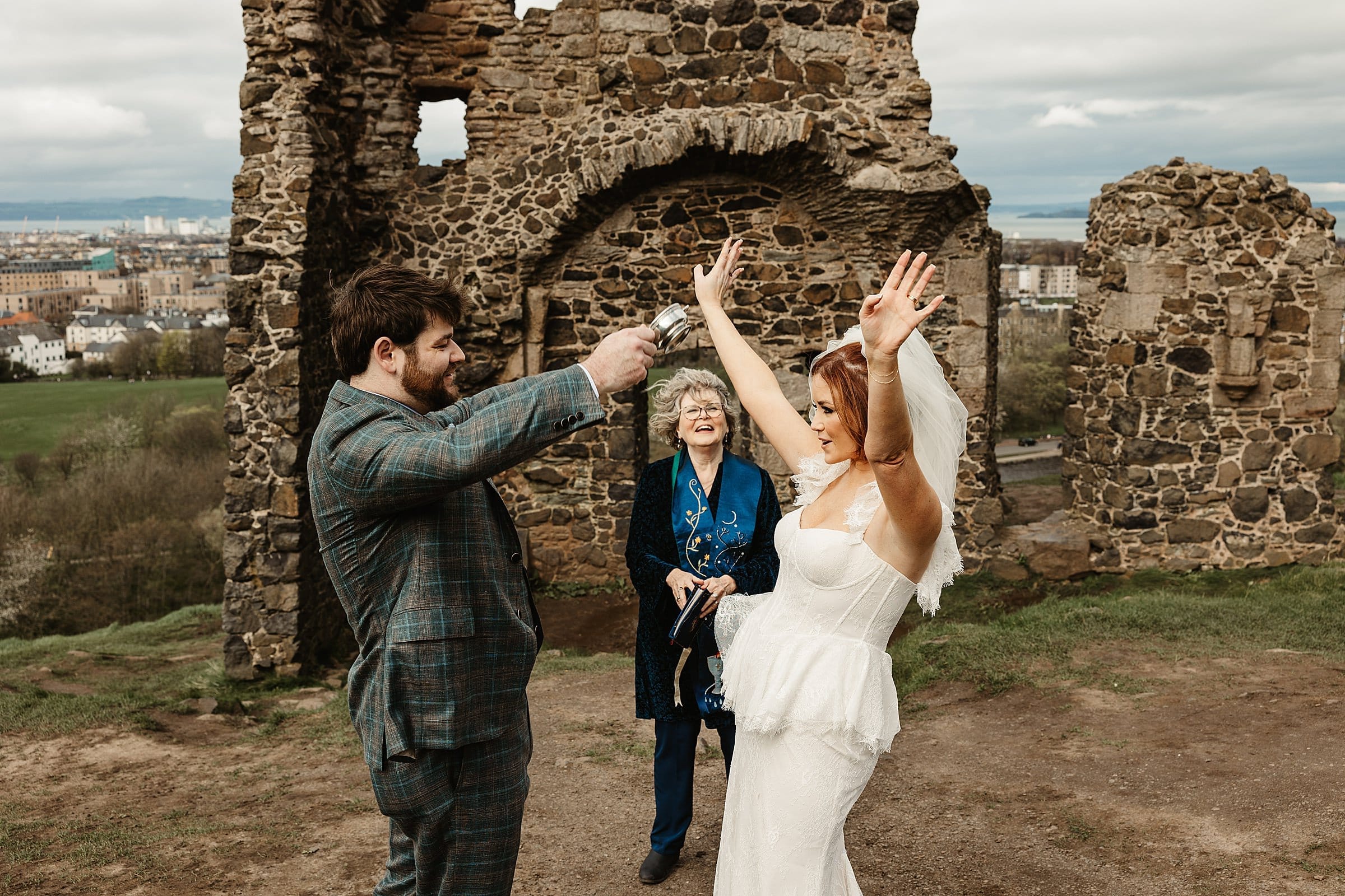 St Anthony's Chapel Ruins elopement wedding photography bride and groom drinking from the quiach