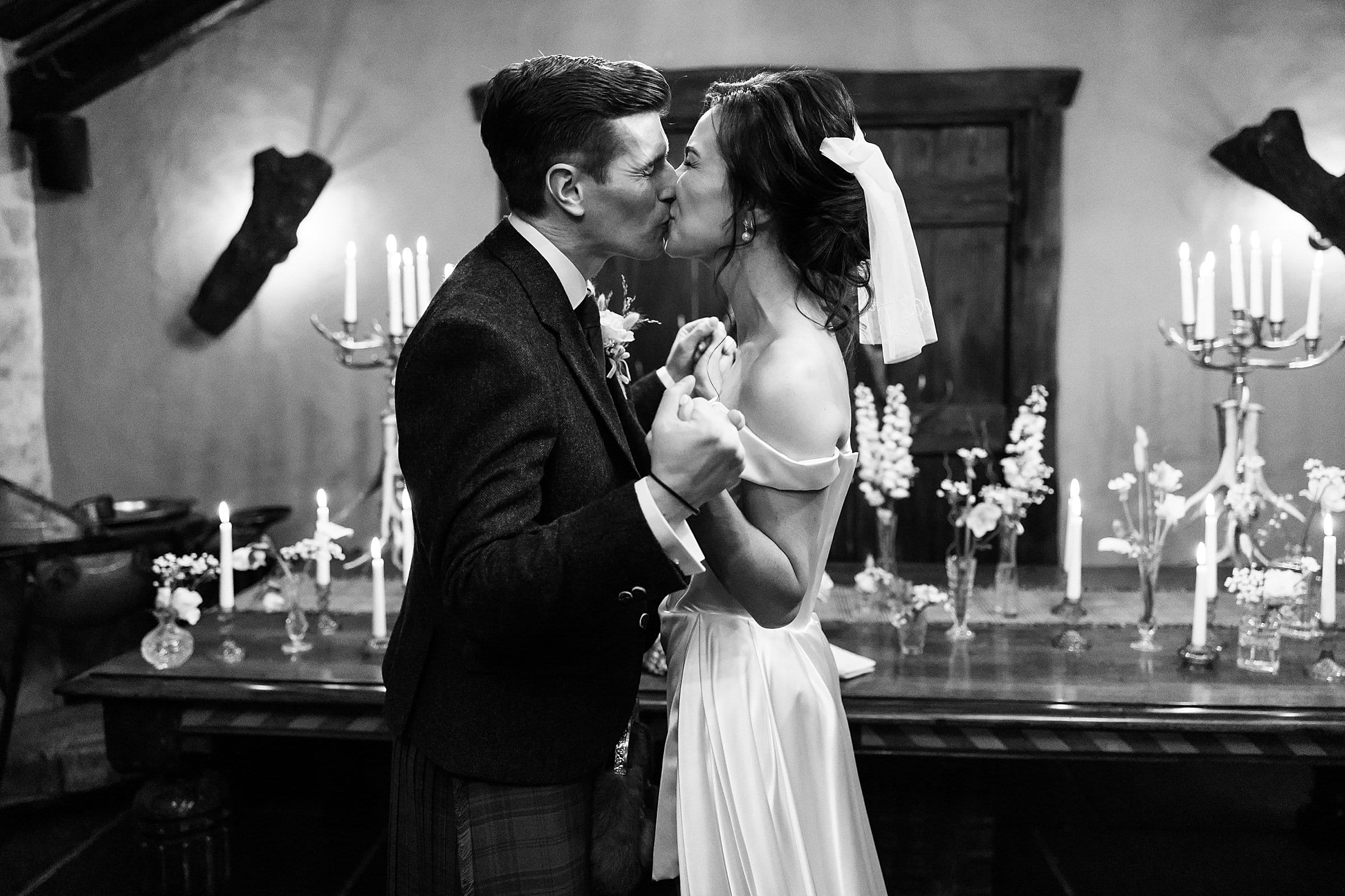 fife arms winter elopement wedding ceremony bride and groom first kiss