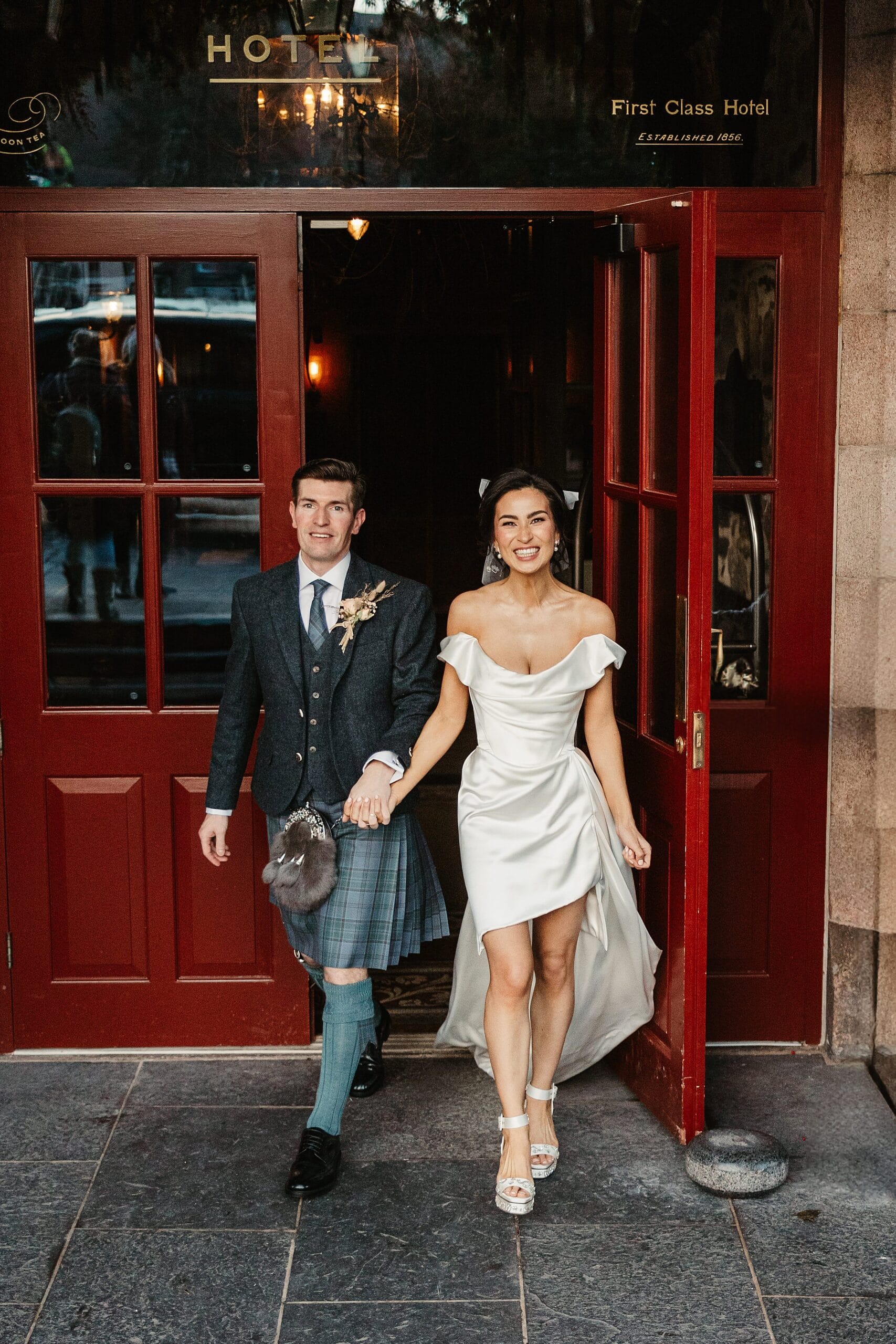 fife arms winter elopement bride and groom leaving the front entrance