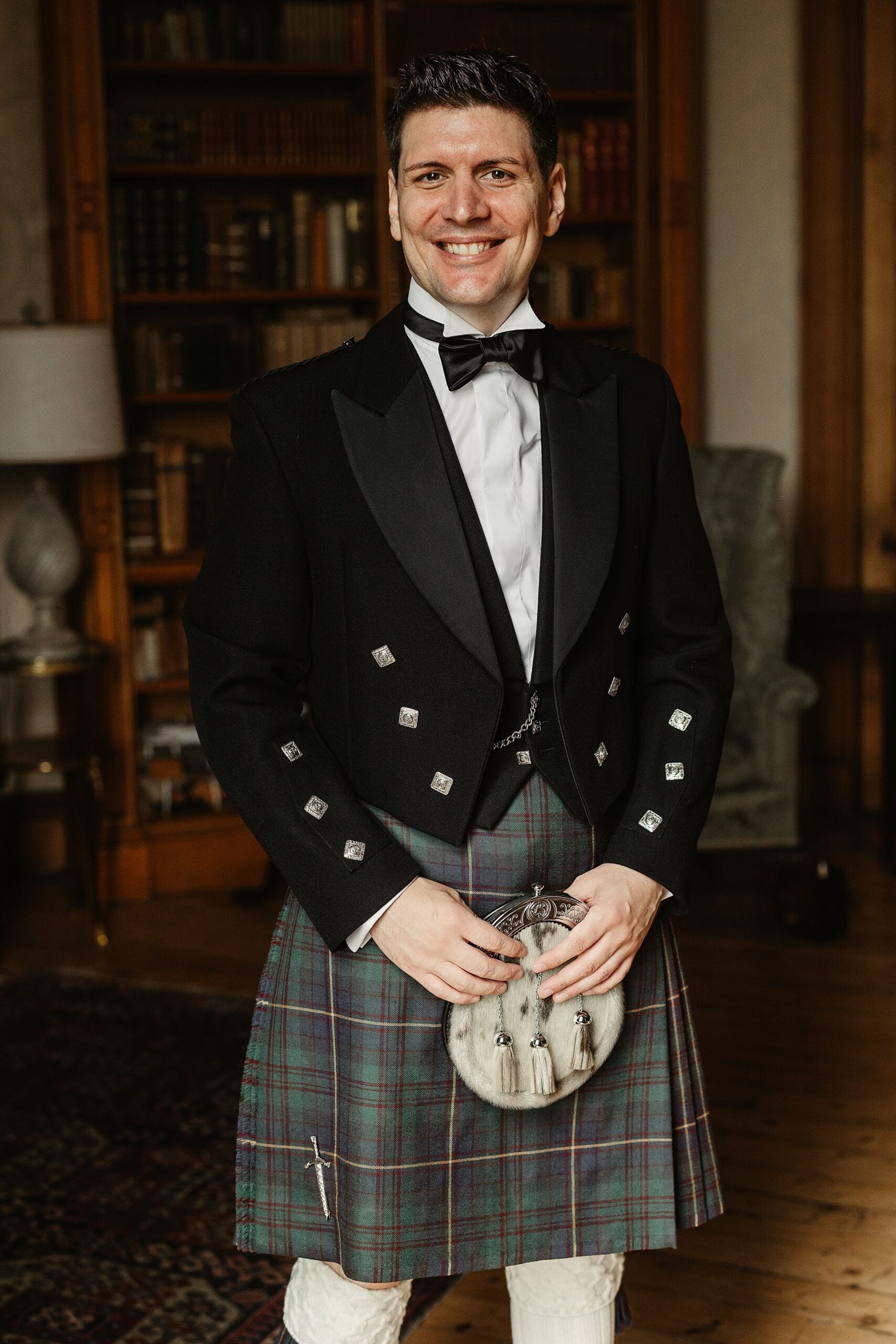 cluny castle wedding groom portrait indoors