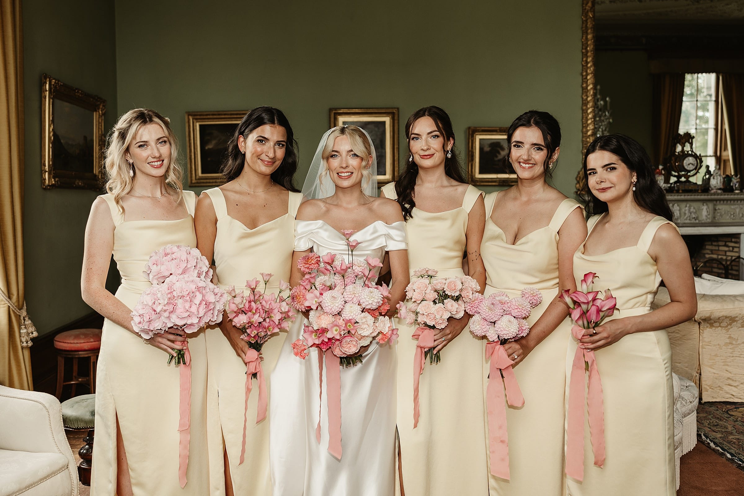 cluny castle wedding bridesmaids and bride group photo pink florals fauna flower folk bouquet