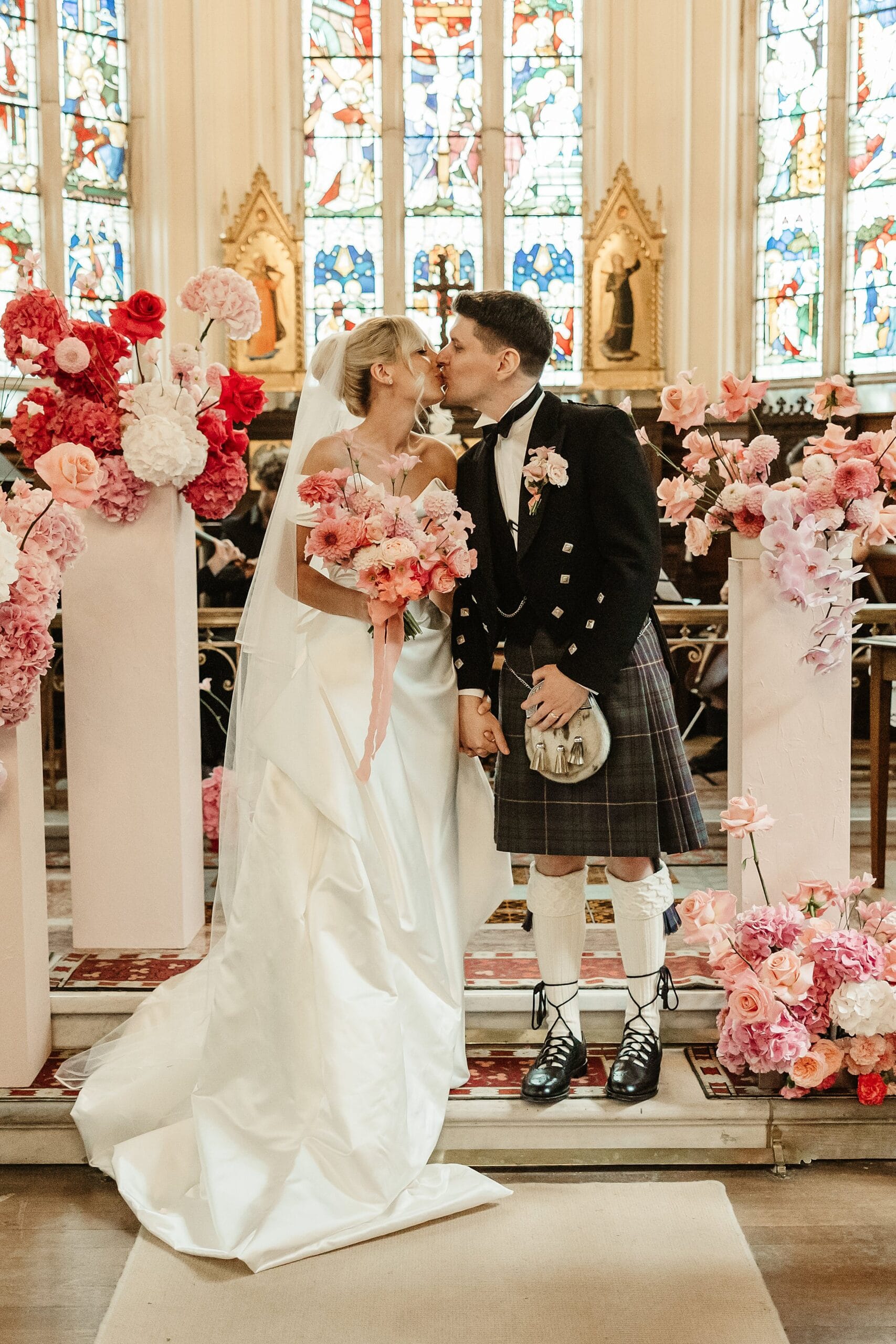 cluny castle wedding ceremony bride and groom vivienne westwood dress first kiss