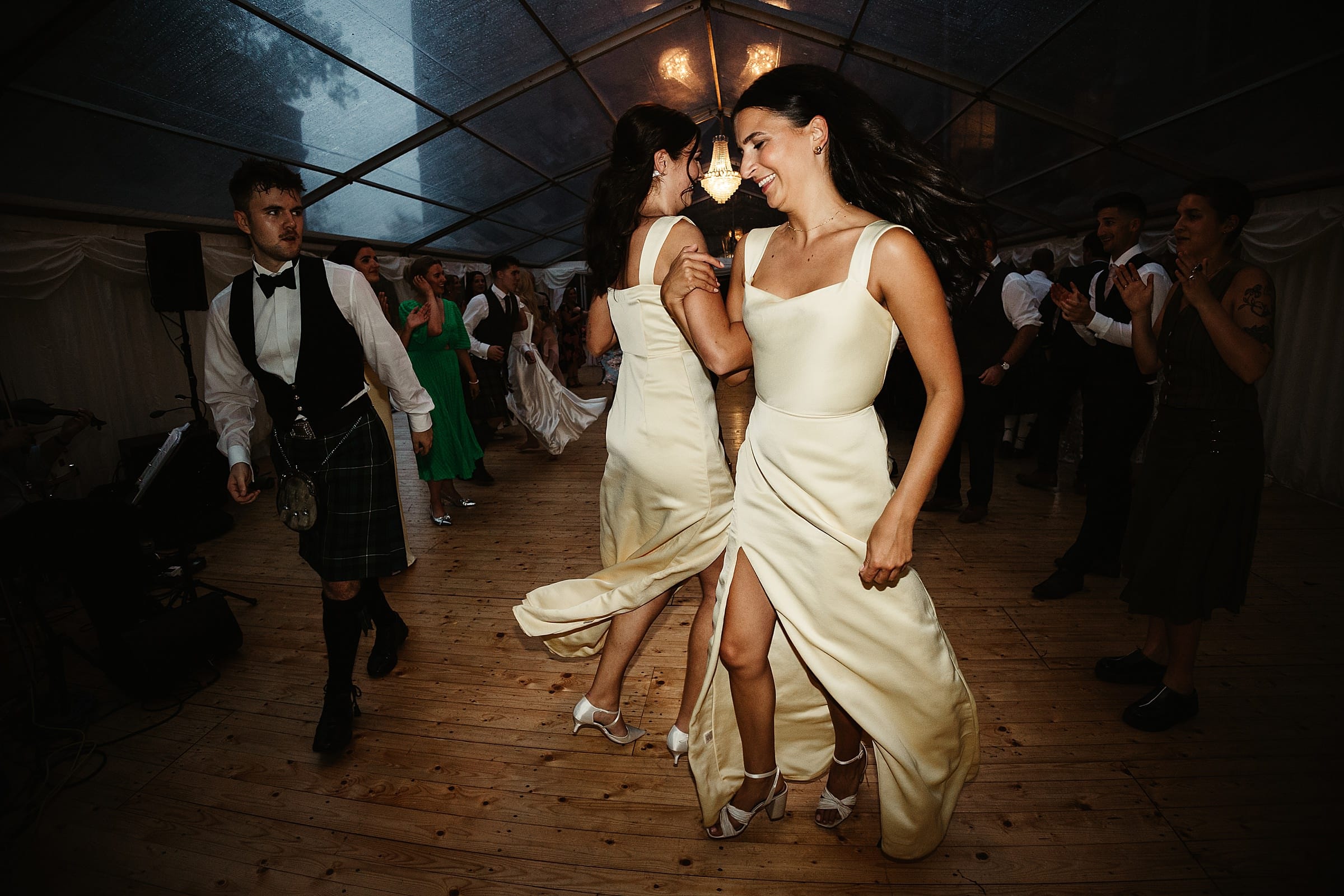 cluny castle wedding ceilidh bridesmaids in yellow dresses